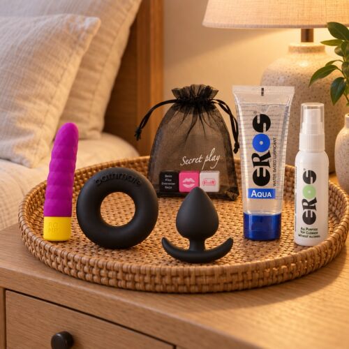 Coffret de sextoys de base avec bullet, anneau, plug et dés – mise en scène d'ambiance (image générée par IA)
