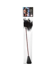 fouet en cuir avec des plumes